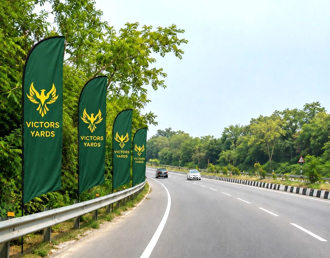Victors Yards feather flags installed along the highway